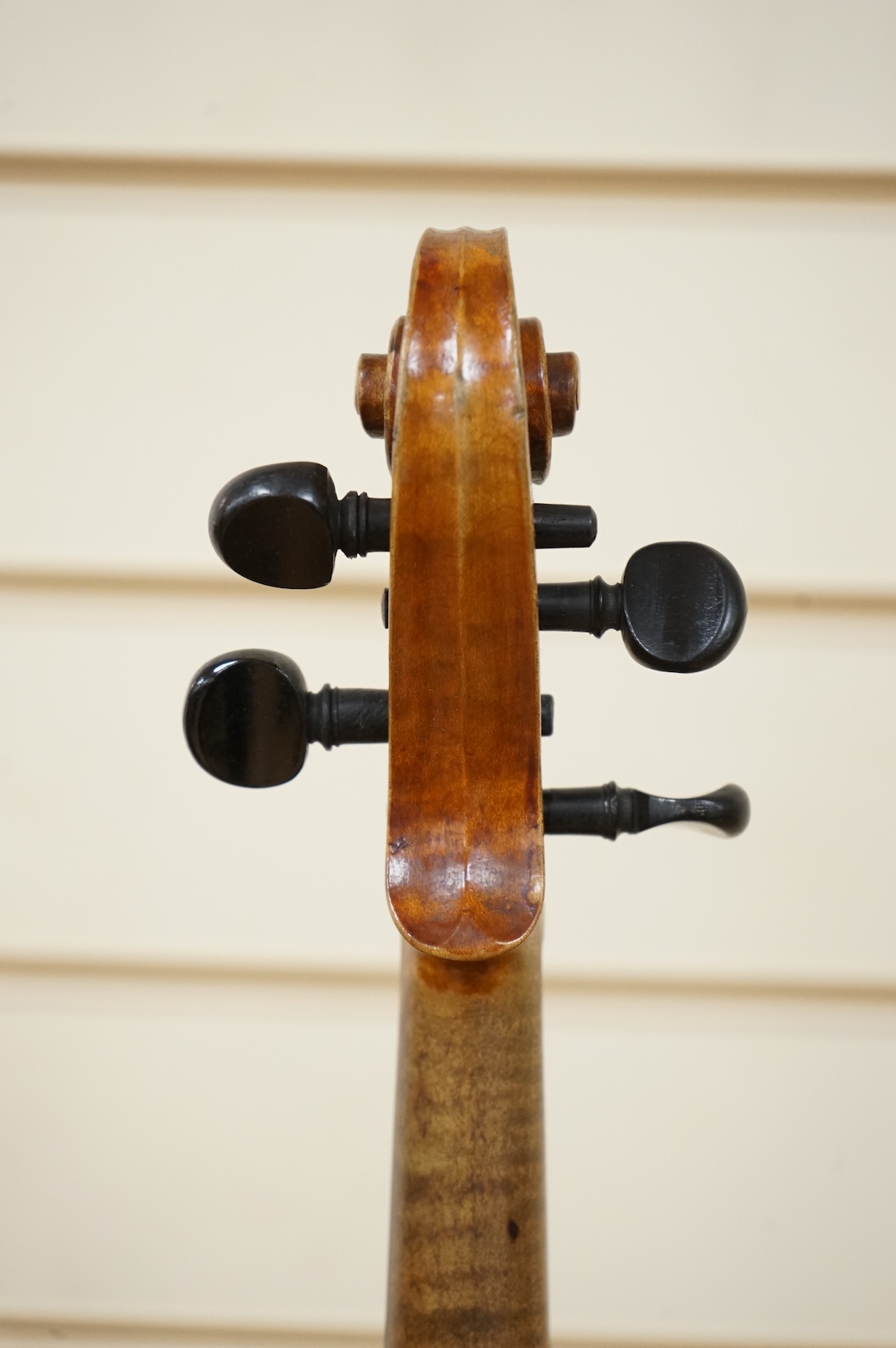 Four violins; a German Dresden violin, together with further two German violins, and a Saxony violin, three in cases or the remains of cases.